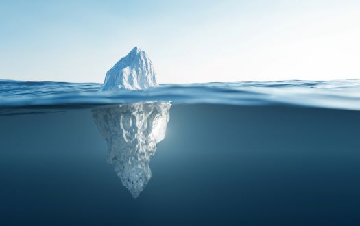 Image of the tip of the iceberg depicting the real problems behind legal spend challenges